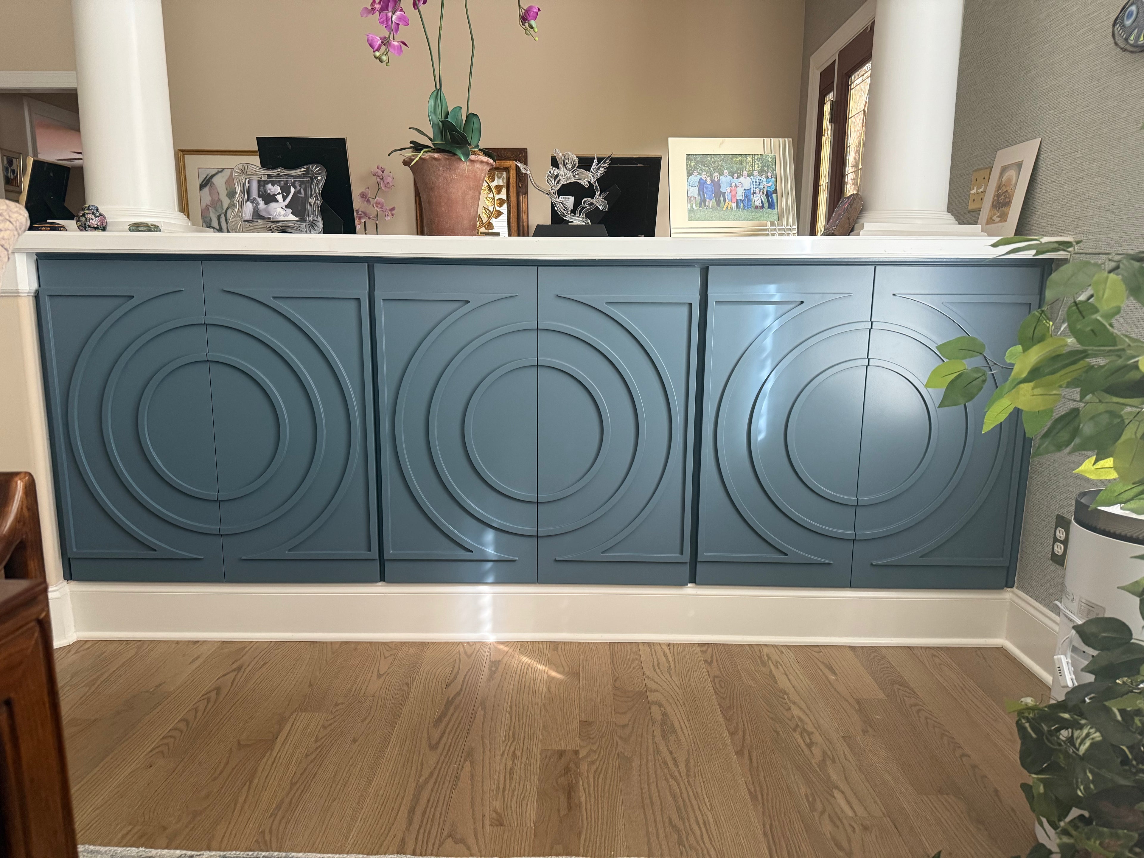 Custom blue reception desk with carved circle panels built by CNC Design Solutions